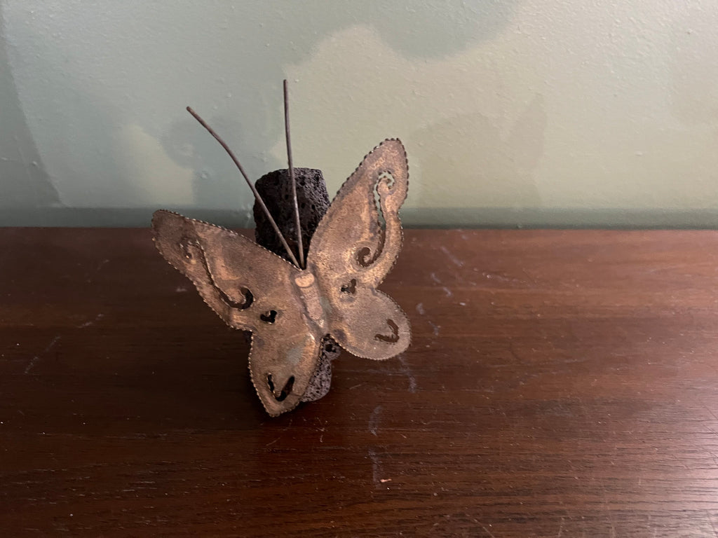 Vintage 70’s brass butterfly on lava rock