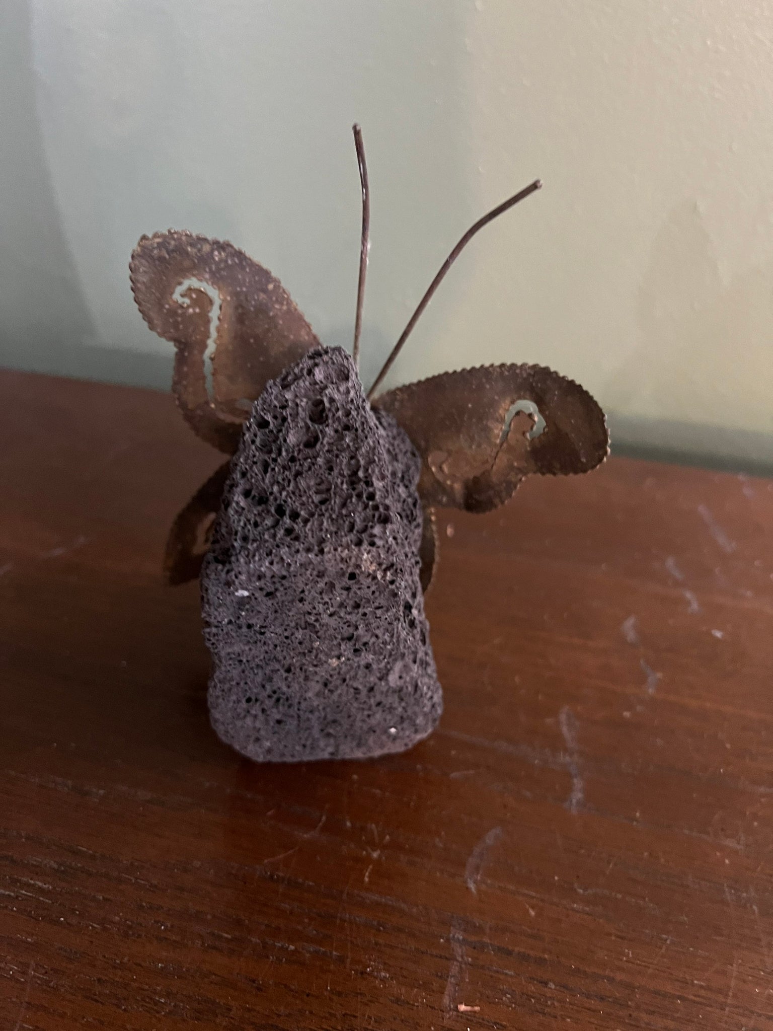 Vintage 70’s brass butterfly on lava rock